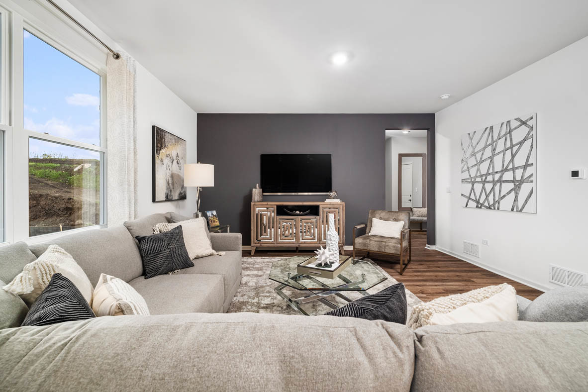 2652 Camelback Drive Pingree Grove, IL 60140 - Photo 11 of 42 a living room with furniture and a flat screen tv
