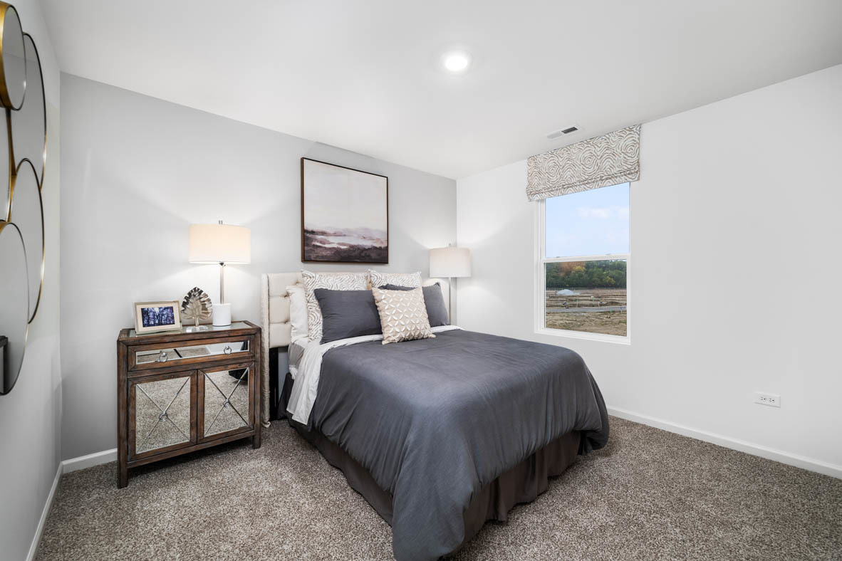 2652 Camelback Drive Pingree Grove, IL 60140 - Photo 21 of 42 a bedroom with a bed and a window
