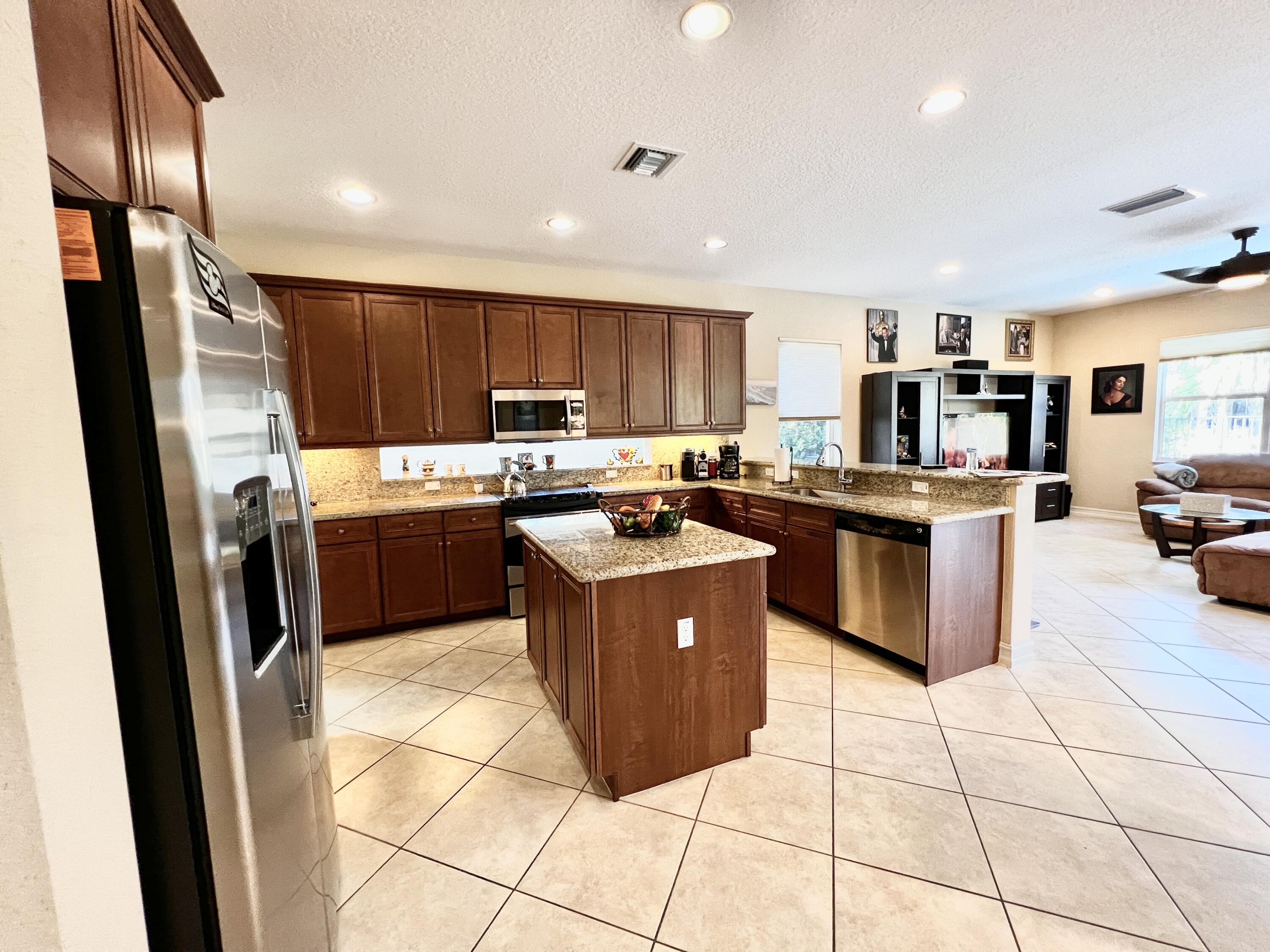 7955 Emerald Winds Circle Boynton Beach, FL 33473 - Photo 11 of 66 Chef's Kitchen w/Transom window & Island