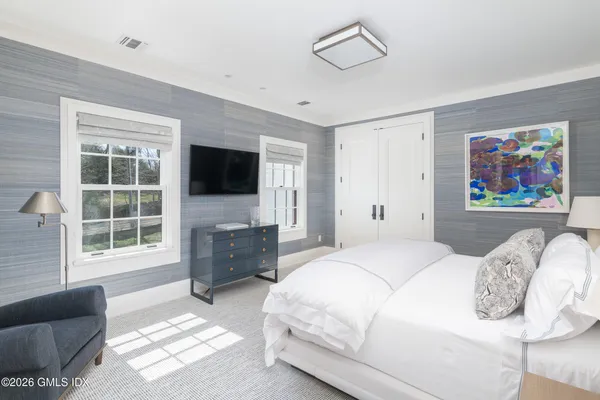 a living room with furniture fireplace and a flat screen tv