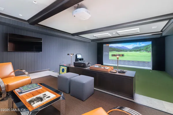 a room with gym equipment and a view of living room