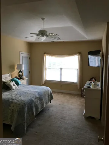 a bed room with a bed and a window