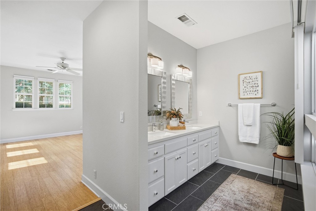 93 Benson Terrace Chico, CA 95928 - Photo 12 of 15 a spacious bathroom with a double vanity sink and a mirror