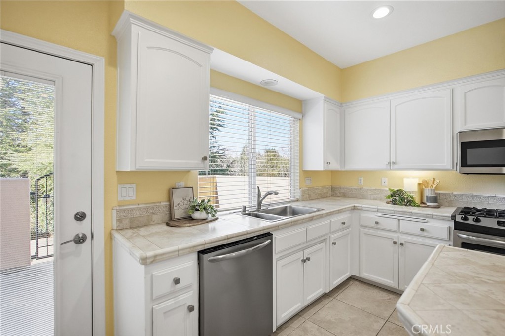93 Benson Terrace Chico, CA 95928 - Photo 5 of 15 a kitchen with a sink stove top oven and cabinets