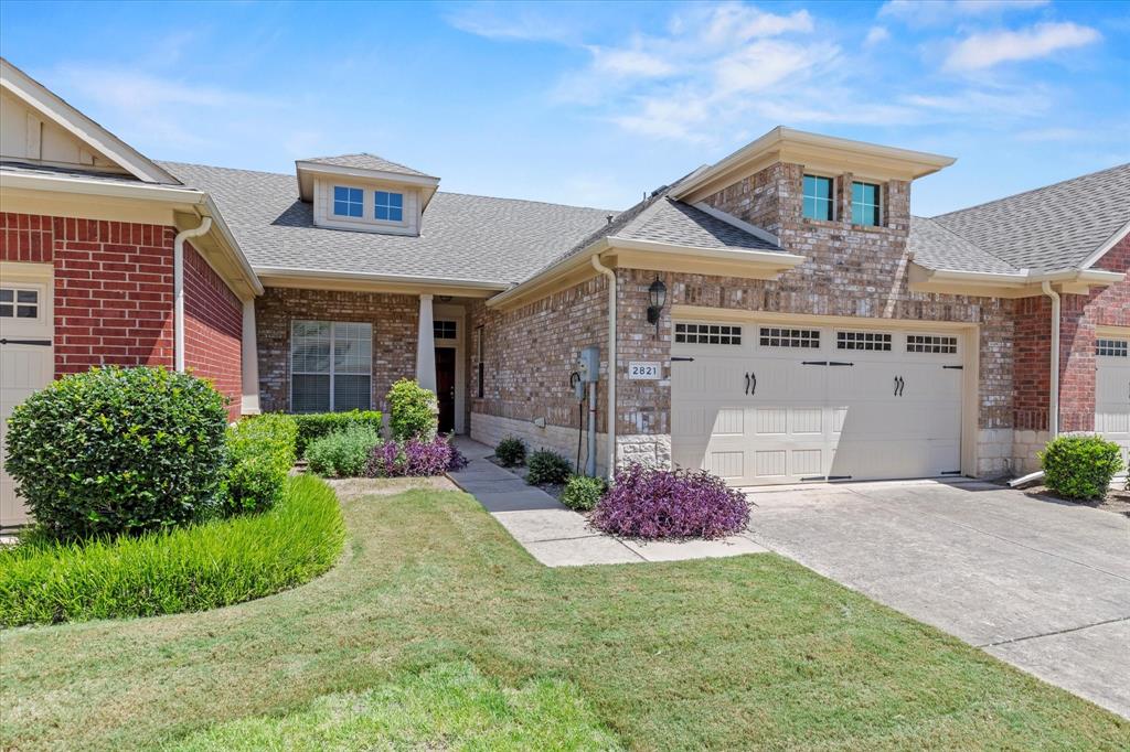 2821 Fordham Road Plano, TX 75025 - Photo 1 of 40 a front view of a house with a garden