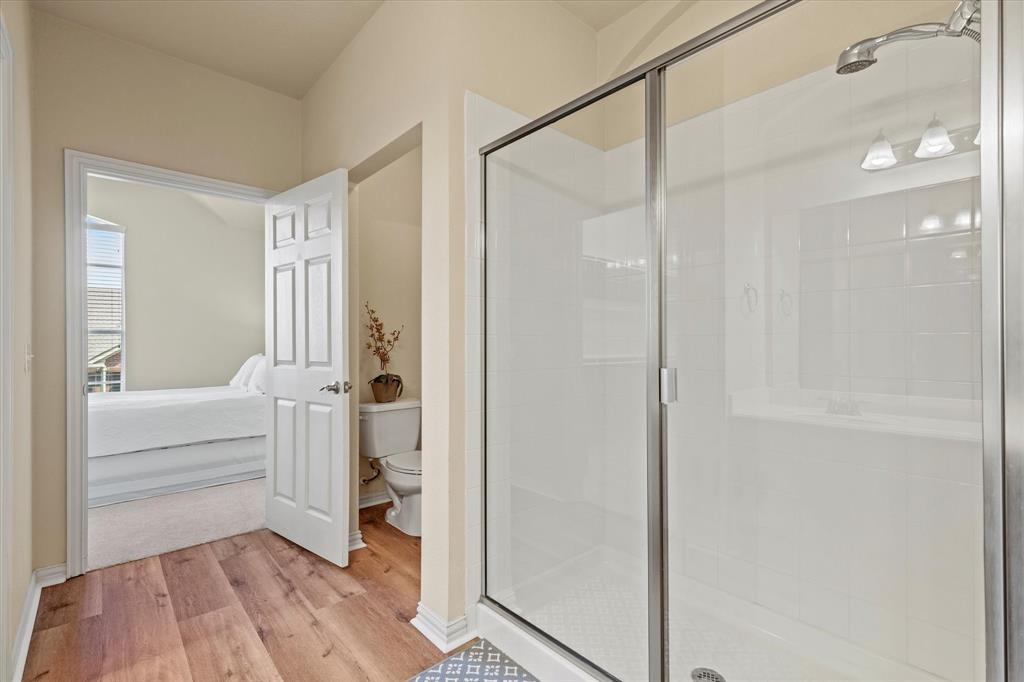 2821 Fordham Road Plano, TX 75025 - Photo 21 of 40 a view of a bathroom with a tub and shower