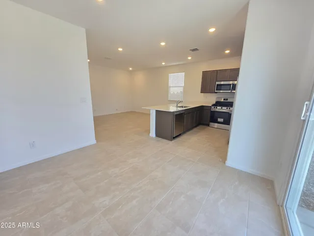 a view of kitchen and kitchen with a sink