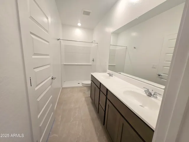 a bathroom with a sink a vanity and a mirror