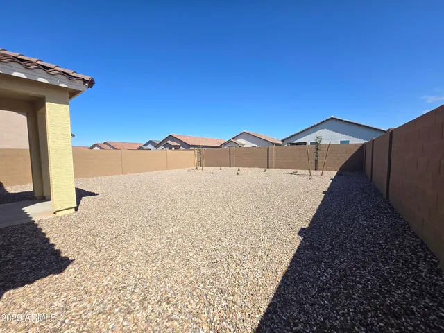 a view of a house with a snow on the road