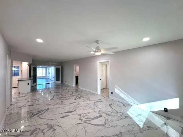 a view of a livingroom with a kitchen