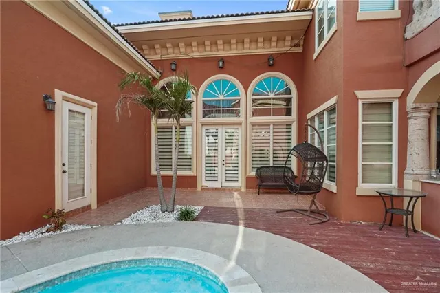 a view of two couches in a room with a window