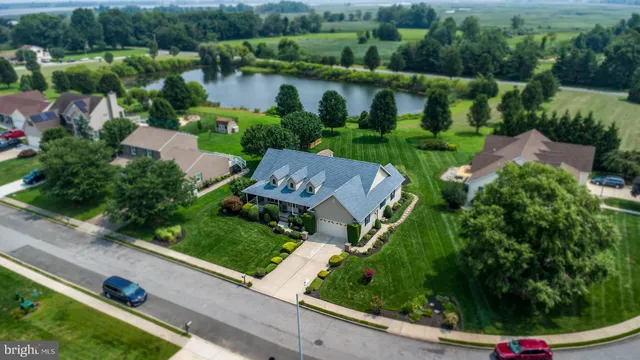 an aerial view of house with yard swimming pool and outdoor seating