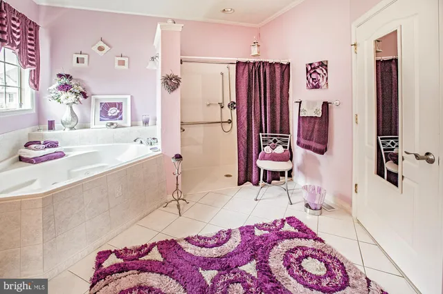 a bedroom with a bed and a table in it