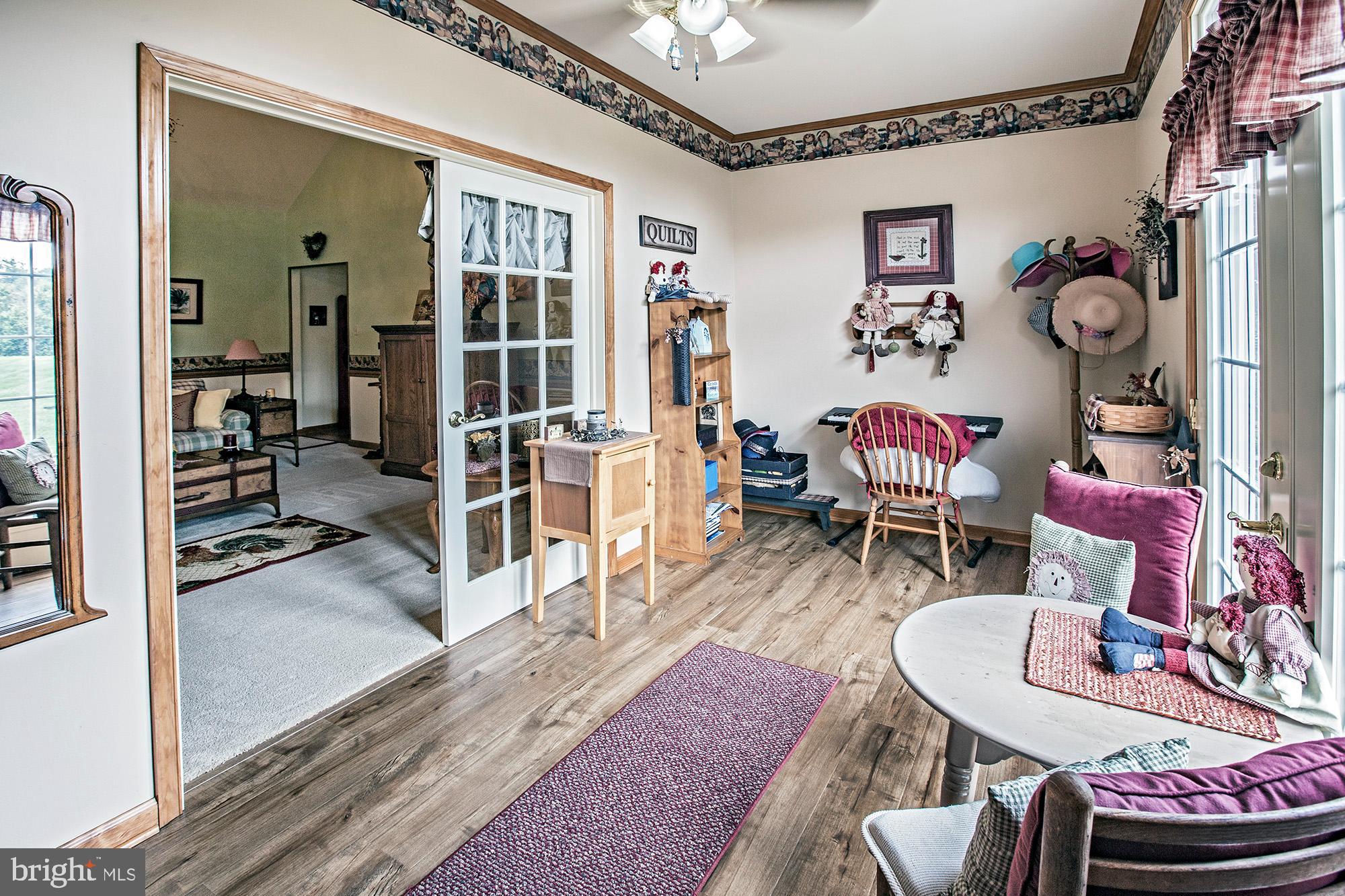 7 Meghans Way Pennsville, NJ 08070 - Photo 19 of 30 a living room with furniture and wooden floor