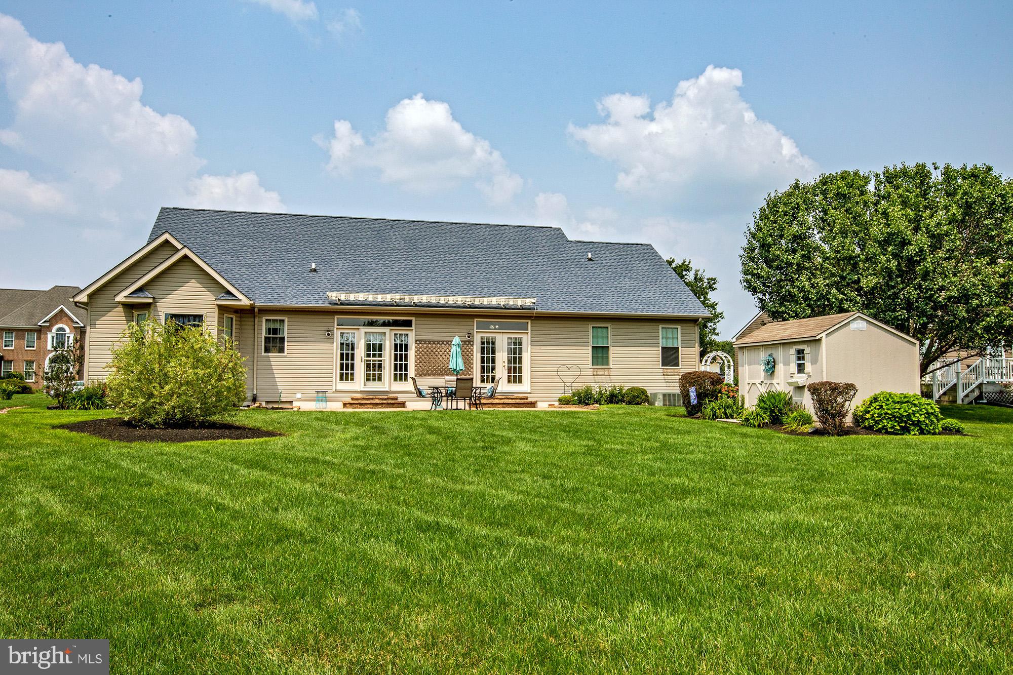 7 Meghans Way Pennsville, NJ 08070 - Photo 26 of 30 a front view of a house with a yard and trees