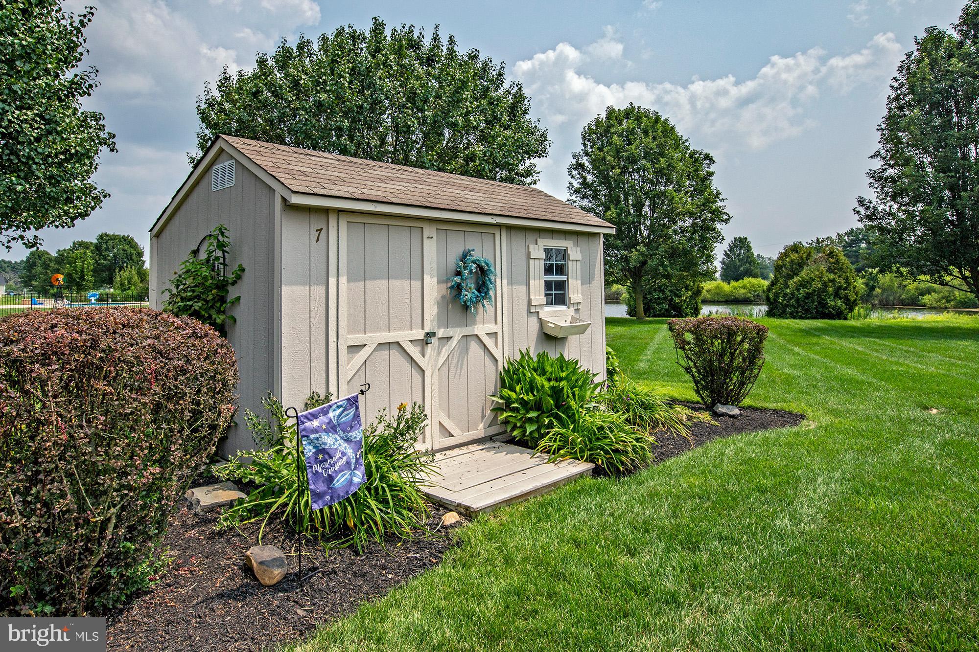 7 Meghans Way Pennsville, NJ 08070 - Photo 27 of 30 a front view of a house with garden