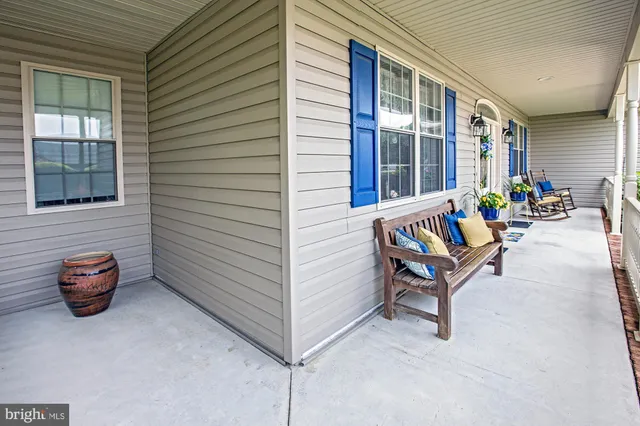 a backyard of a house with outdoor seating