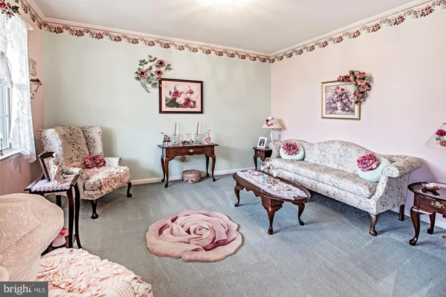a living room with furniture and a table
