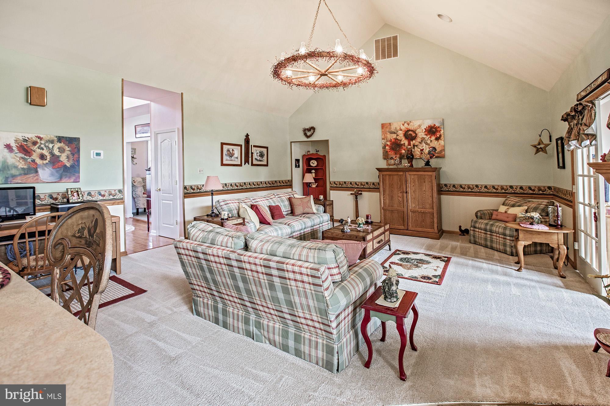 7 Meghans Way Pennsville, NJ 08070 - Photo 8 of 30 a bedroom with furniture and a chandelier