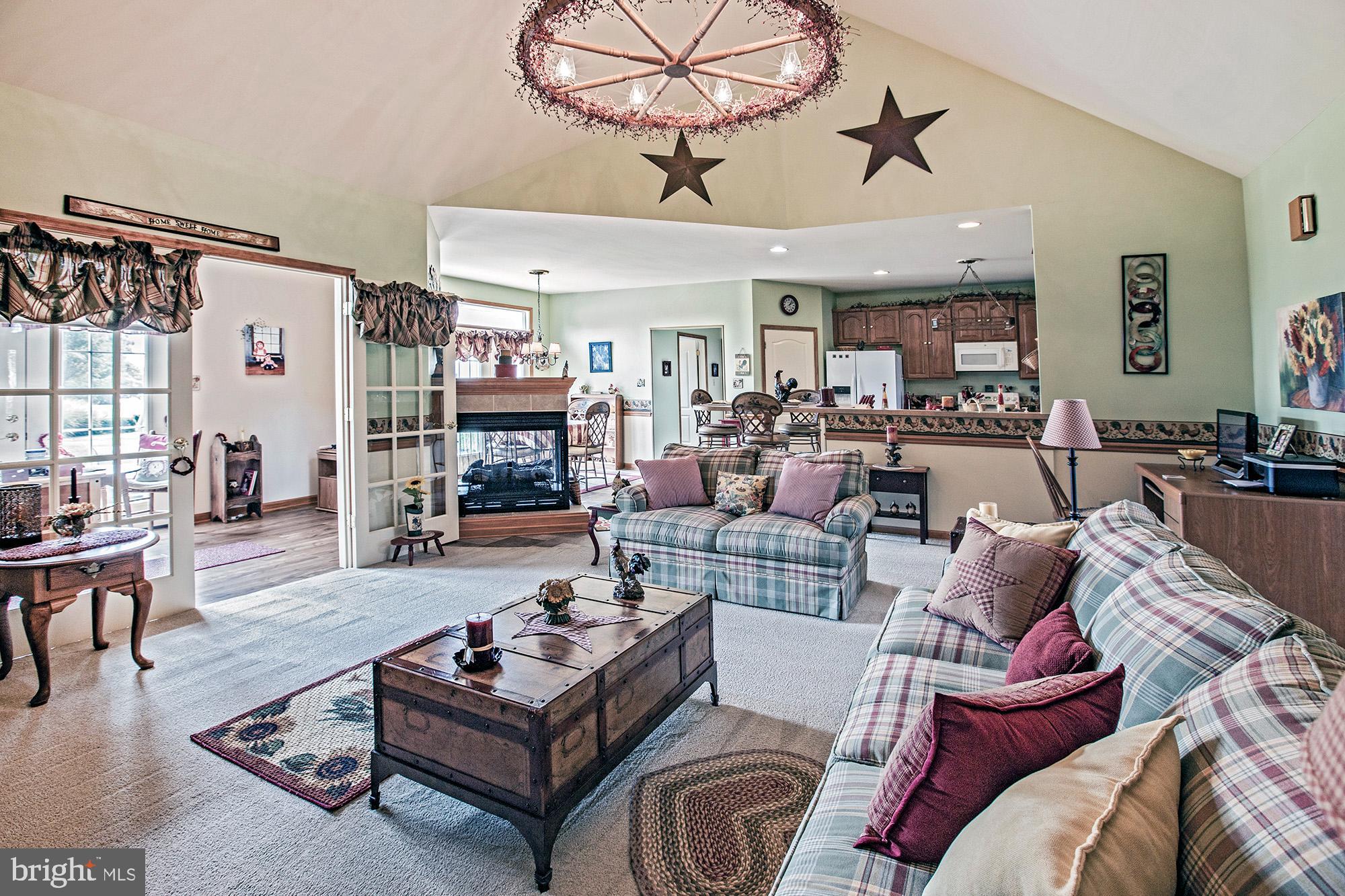 7 Meghans Way Pennsville, NJ 08070 - Photo 9 of 30 a living room with furniture and a fireplace