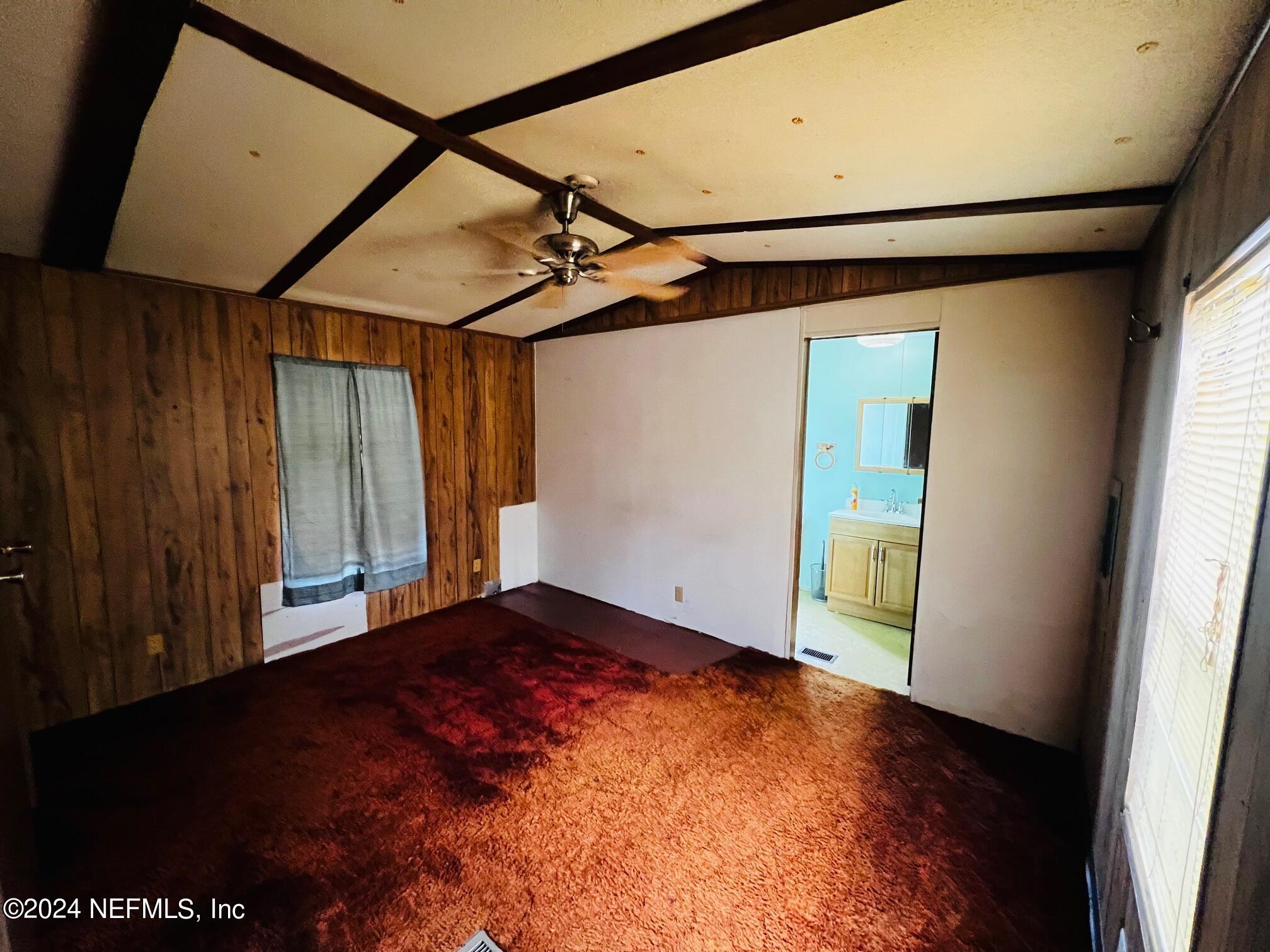 7635 Oak Forest Road Keystone Heights, FL 32656 - Photo 12 of 30 a view of empty room with wooden floor and fan