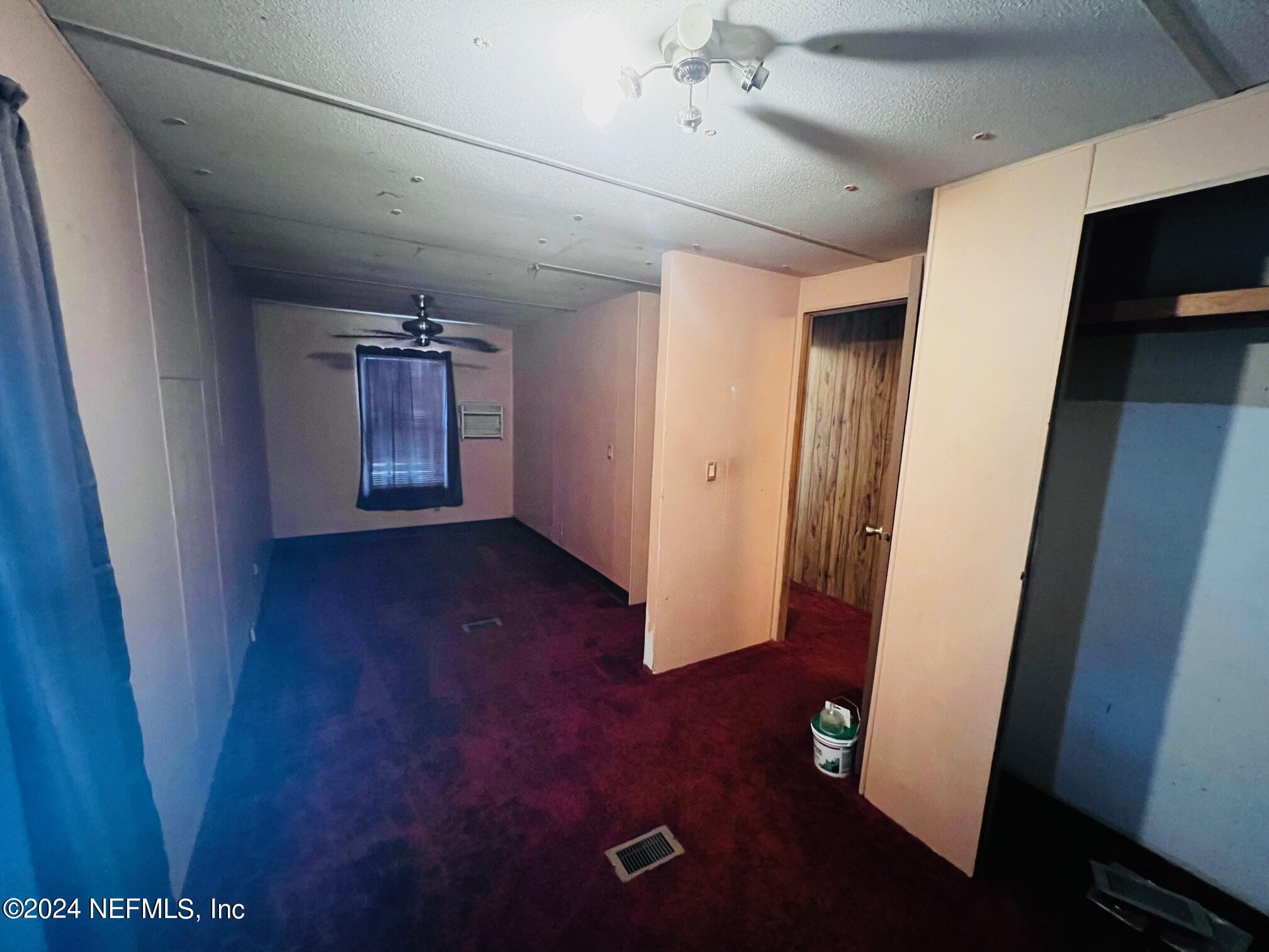 7635 Oak Forest Road Keystone Heights, FL 32656 - Photo 17 of 30 en empty room with hard wood floors
