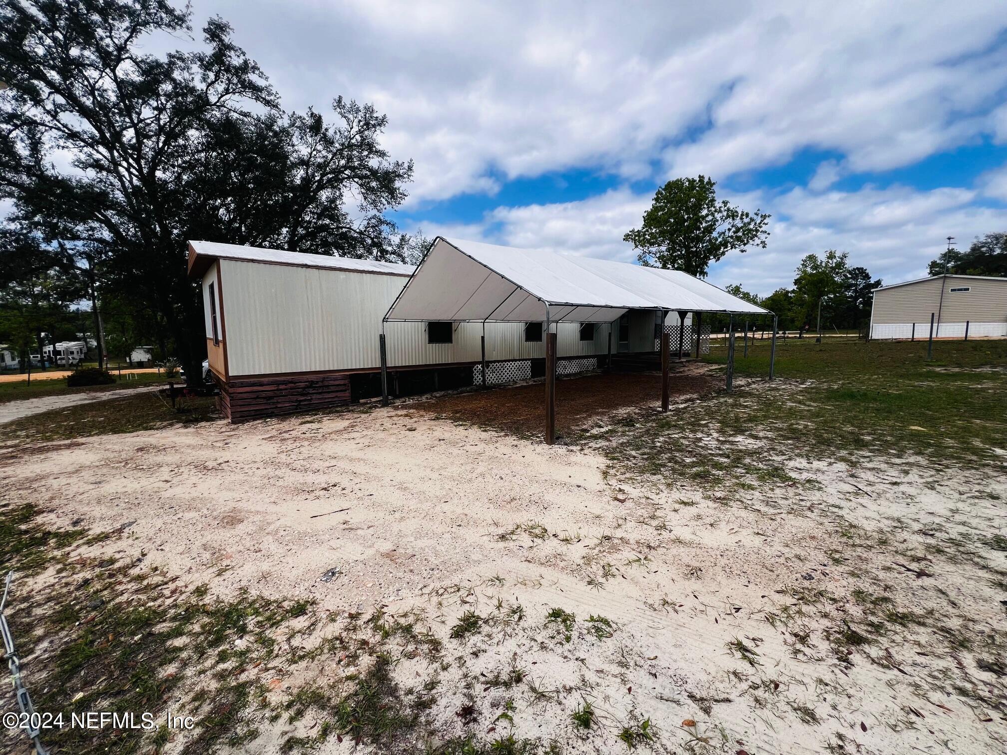 7635 Oak Forest Road Keystone Heights, FL 32656 - Photo 23 of 30 a view of a house with a yard
