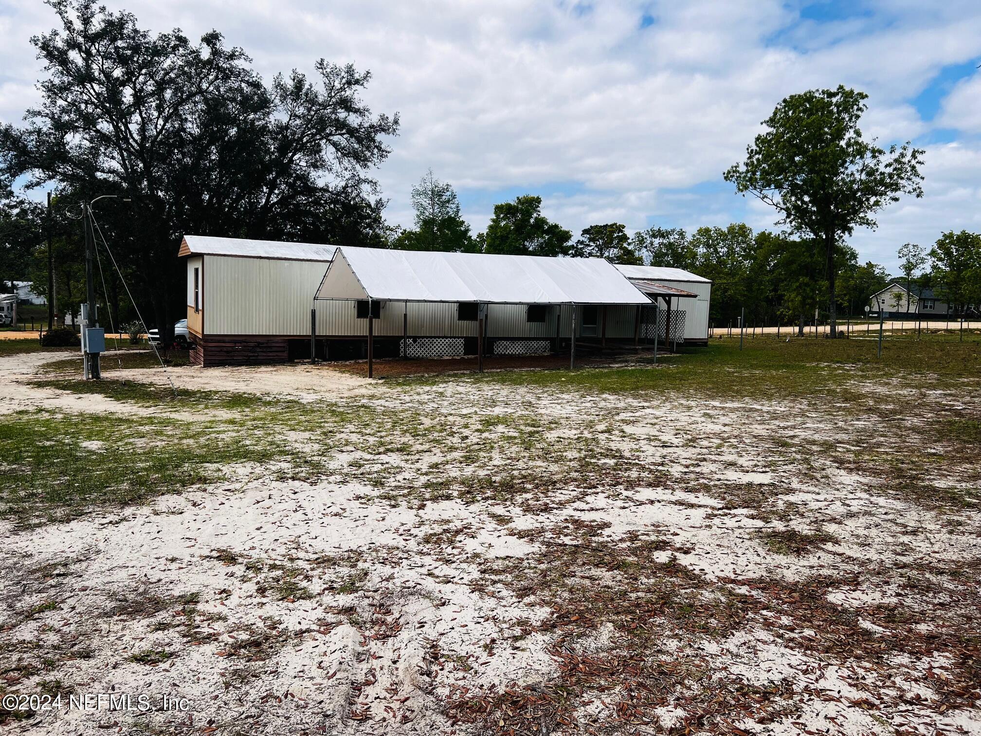 7635 Oak Forest Road Keystone Heights, FL 32656 - Photo 25 of 30 a view of a house with a yard