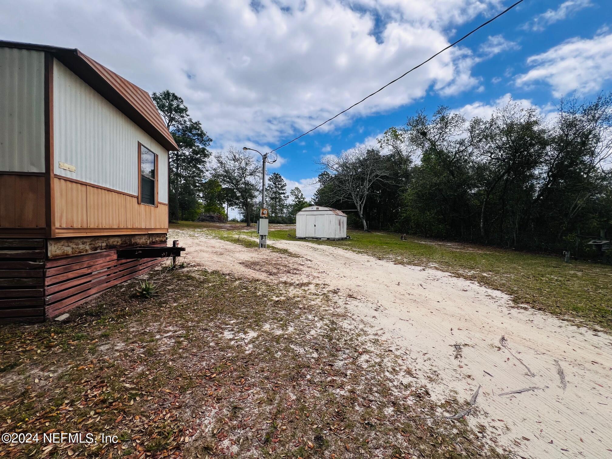 7635 Oak Forest Road Keystone Heights, FL 32656 - Photo 26 of 30 a view of a backyard with a house