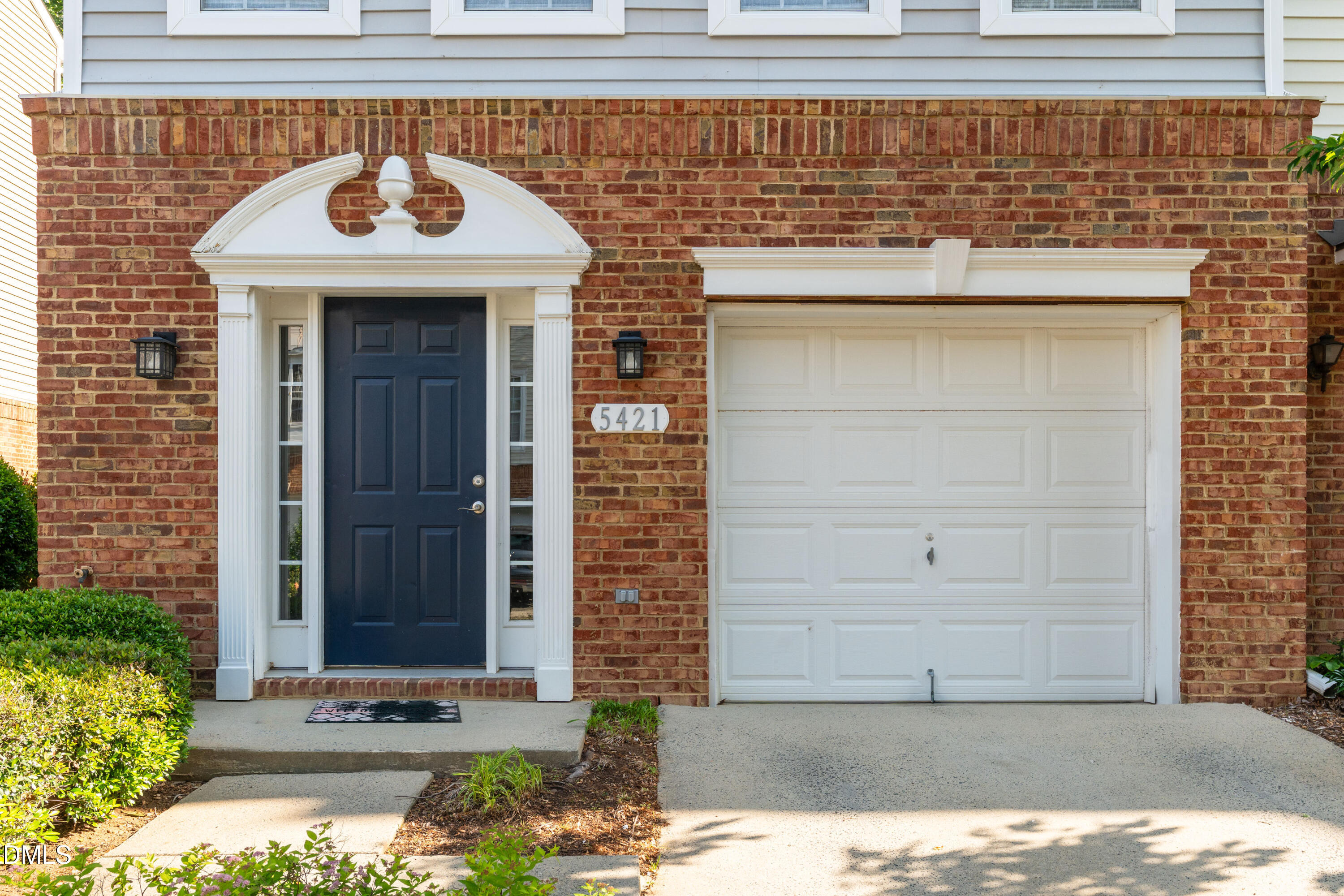 5421 Golden Arrow Lane Raleigh, NC 27613 - Photo 5 of 49 a front view of a house with a yard