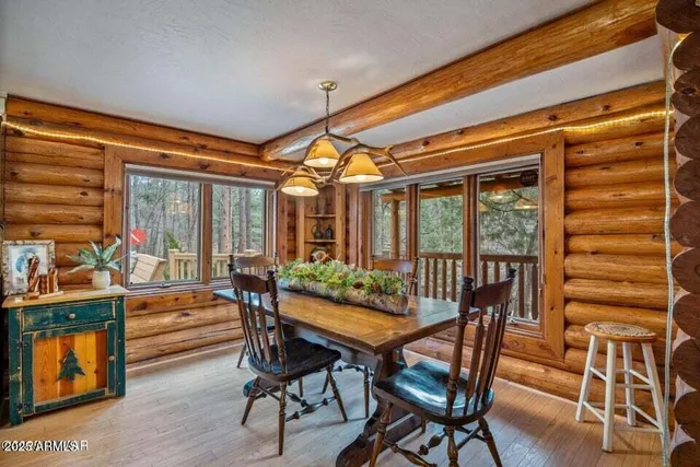 a outdoor dining space with chairs and wooden floor