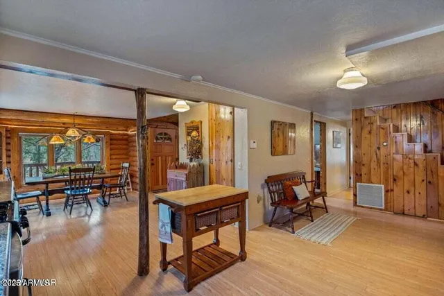 a living room filled with furniture and a large window