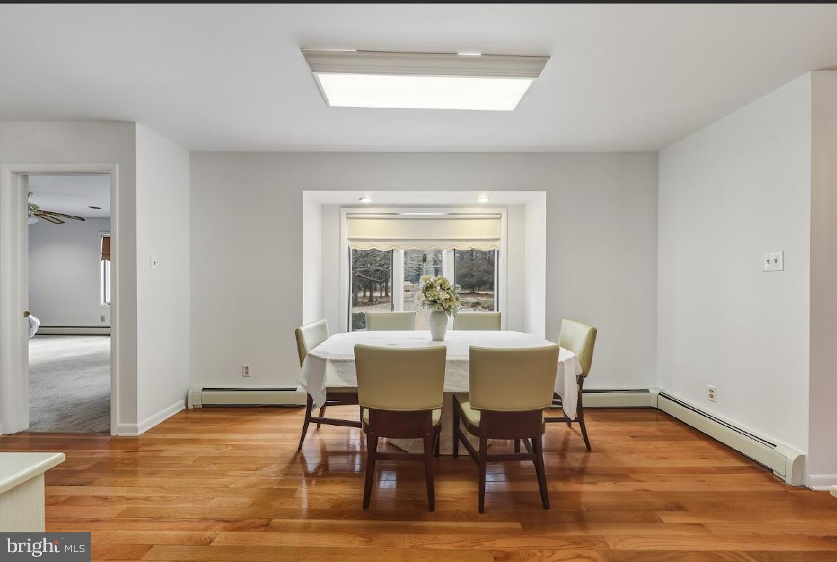 1159 Moss Mill Road Hammonton, NJ 08037 - Photo 16 of 31 a view of a dining room with furniture window and wooden floor