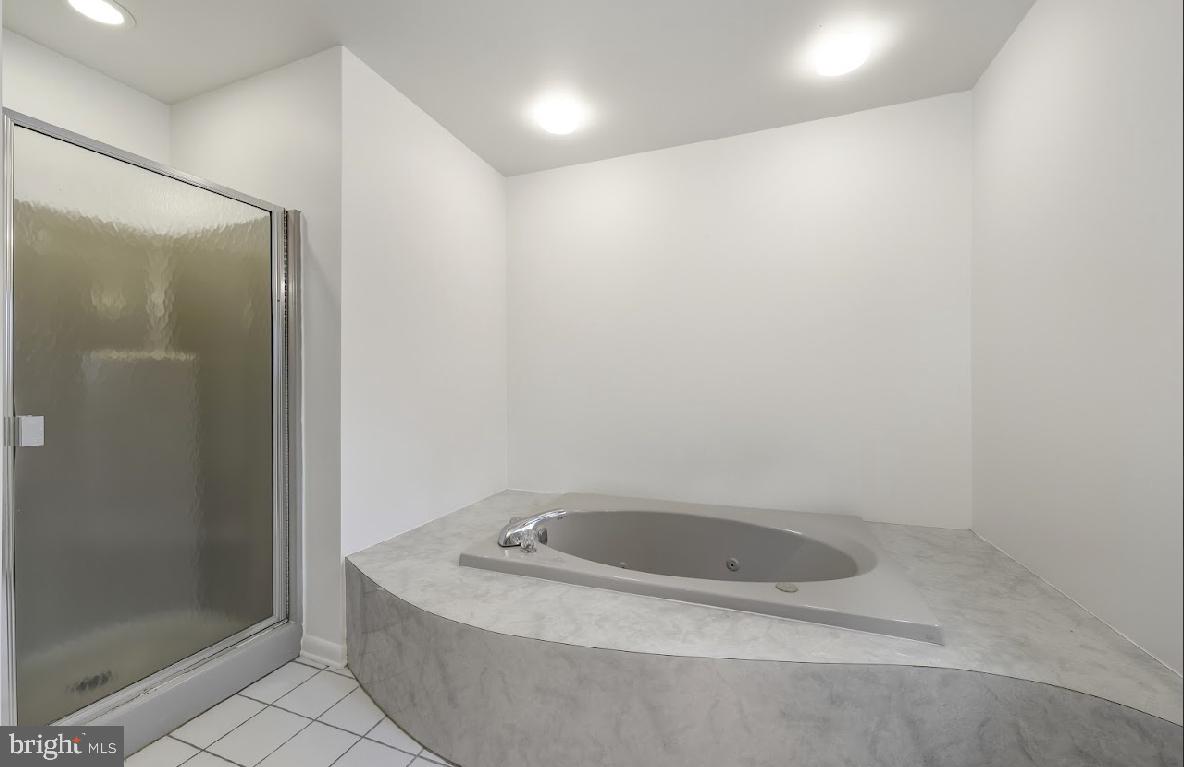 1159 Moss Mill Road Hammonton, NJ 08037 - Photo 17 of 31 a bathroom with a tub and shower