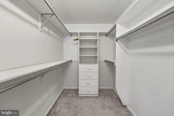 a white toilet sitting next to a bathroom sink