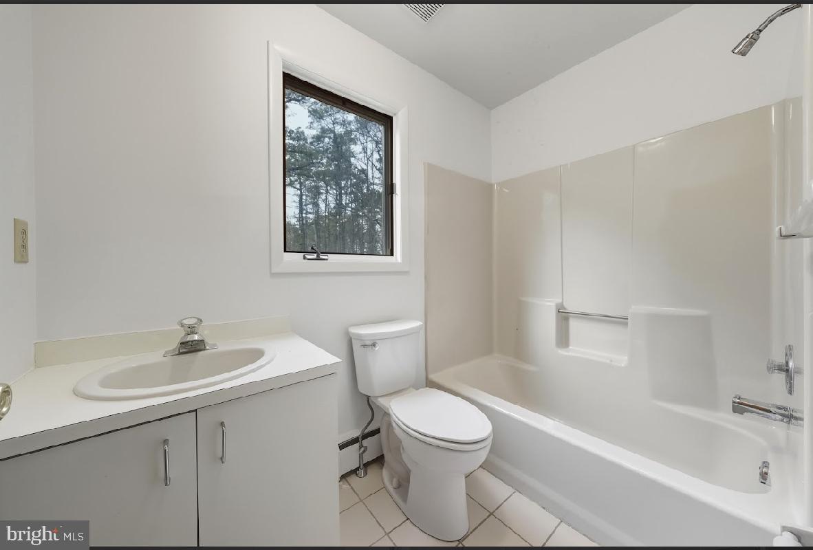 1159 Moss Mill Road Hammonton, NJ 08037 - Photo 19 of 31 a white toilet sitting next to a bathroom sink