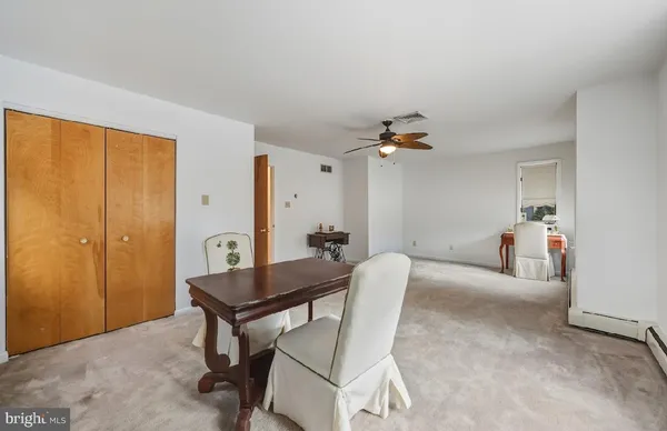 a view of a livingroom with furniture and a window