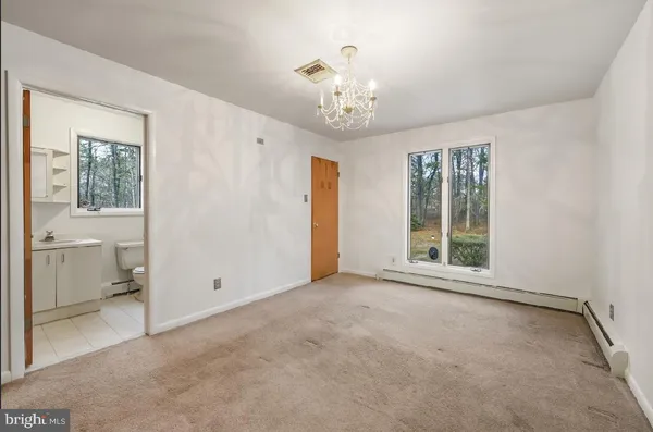 an empty room with chandelier