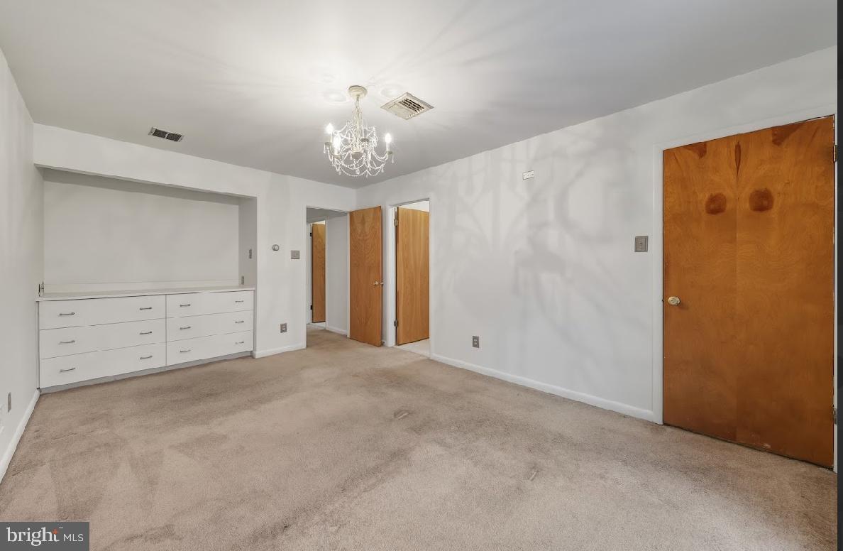 1159 Moss Mill Road Hammonton, NJ 08037 - Photo 24 of 31 an empty room with chandelier