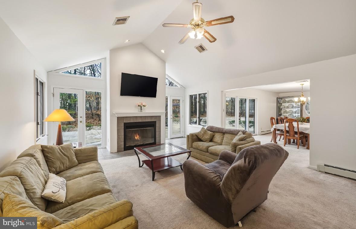 1159 Moss Mill Road Hammonton, NJ 08037 - Photo 6 of 31 a living room with furniture a flat screen tv and a fireplace