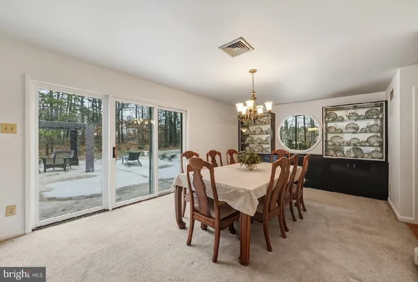 a view of a livingroom with furniture and wooden floor