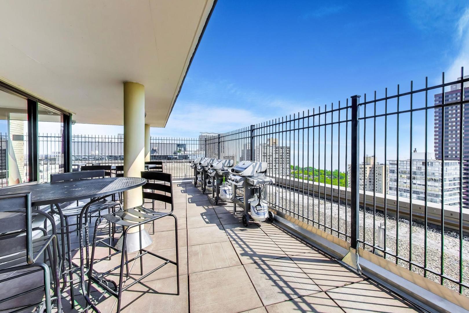 2930 North Sheridan Road, Unit 702 Chicago, IL 60657 - Photo 24 of 25 a view of a balcony with chairs