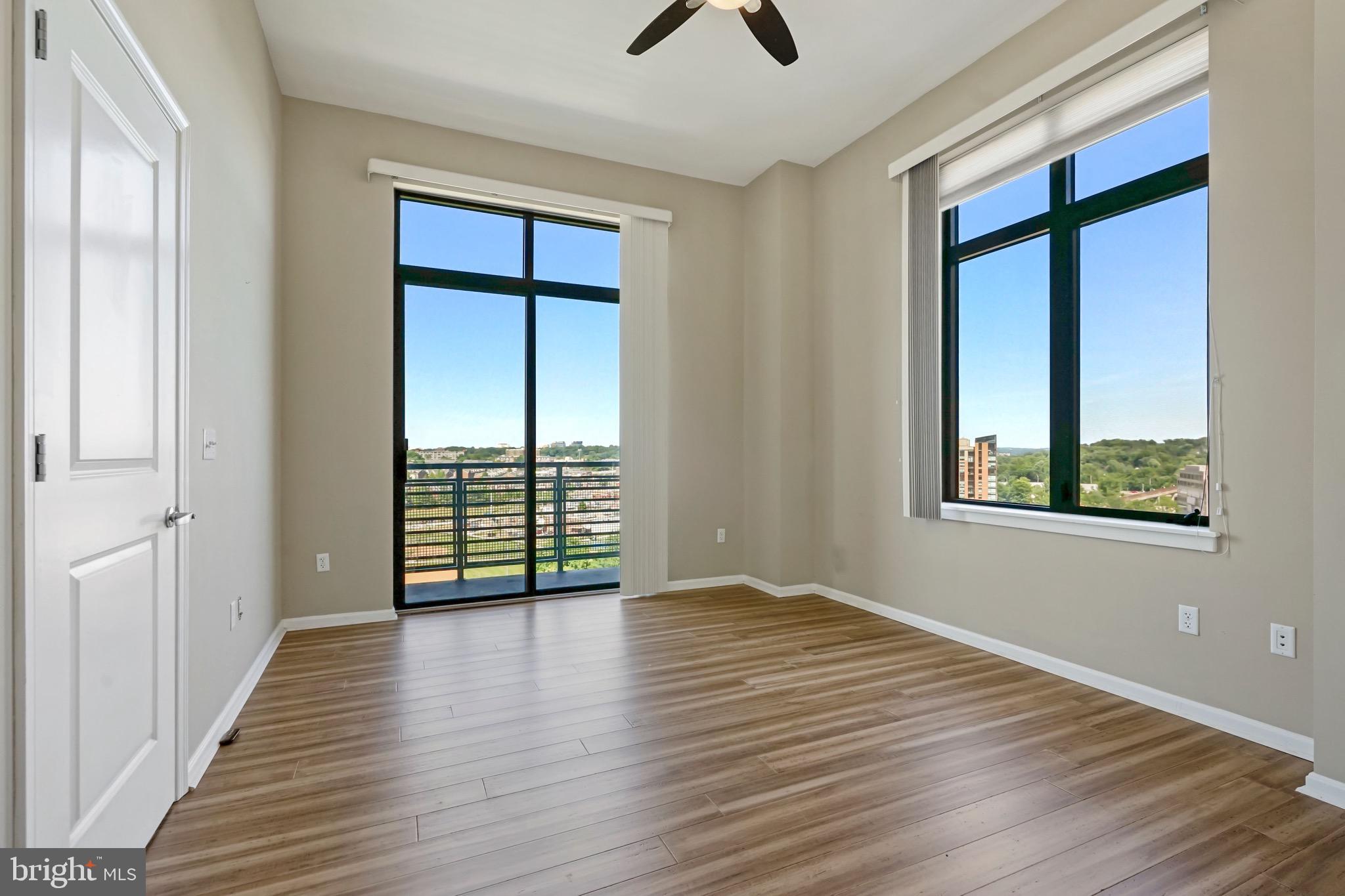 2720 South Arlington Mill Drive, Unit 1102 Arlington, VA 22206 - Photo 16 of 28 wooden floor in an empty room with a window