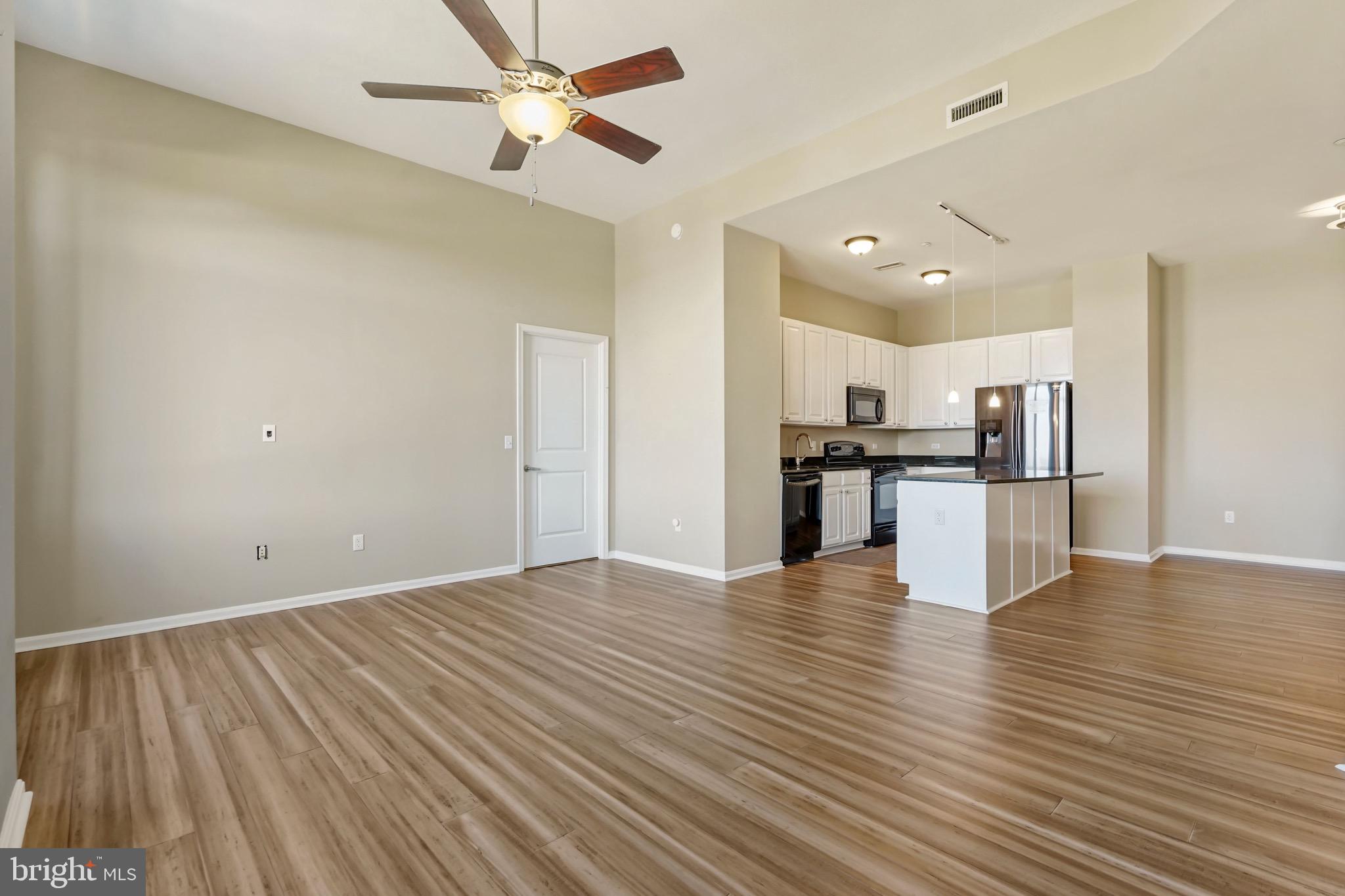 2720 South Arlington Mill Drive, Unit 1102 Arlington, VA 22206 - Photo 18 of 28 a view of kitchen with refrigerator microwave and stove
