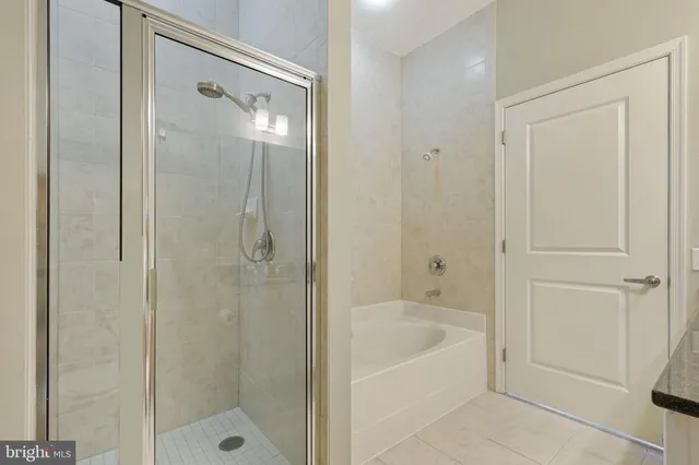 a bathroom with a bathtub and shower