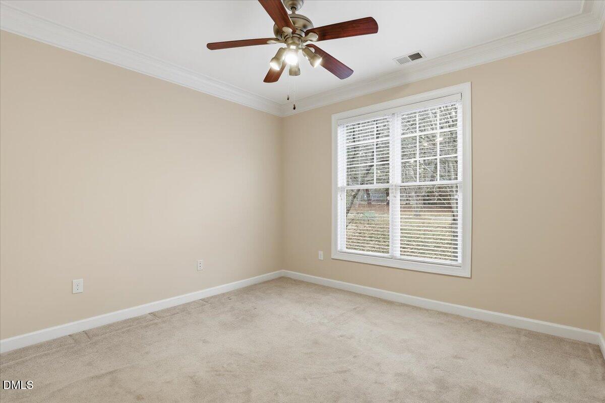 1301 Durlain Drive, Unit 208 Raleigh, NC 27614 - Photo 16 of 28 an empty room with a window and a ceiling fan