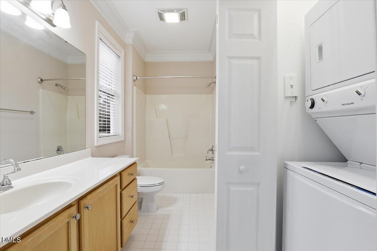 1301 Durlain Drive, Unit 208 Raleigh, NC 27614 - Photo 25 of 28 a bathroom with a sink a toilet and shower