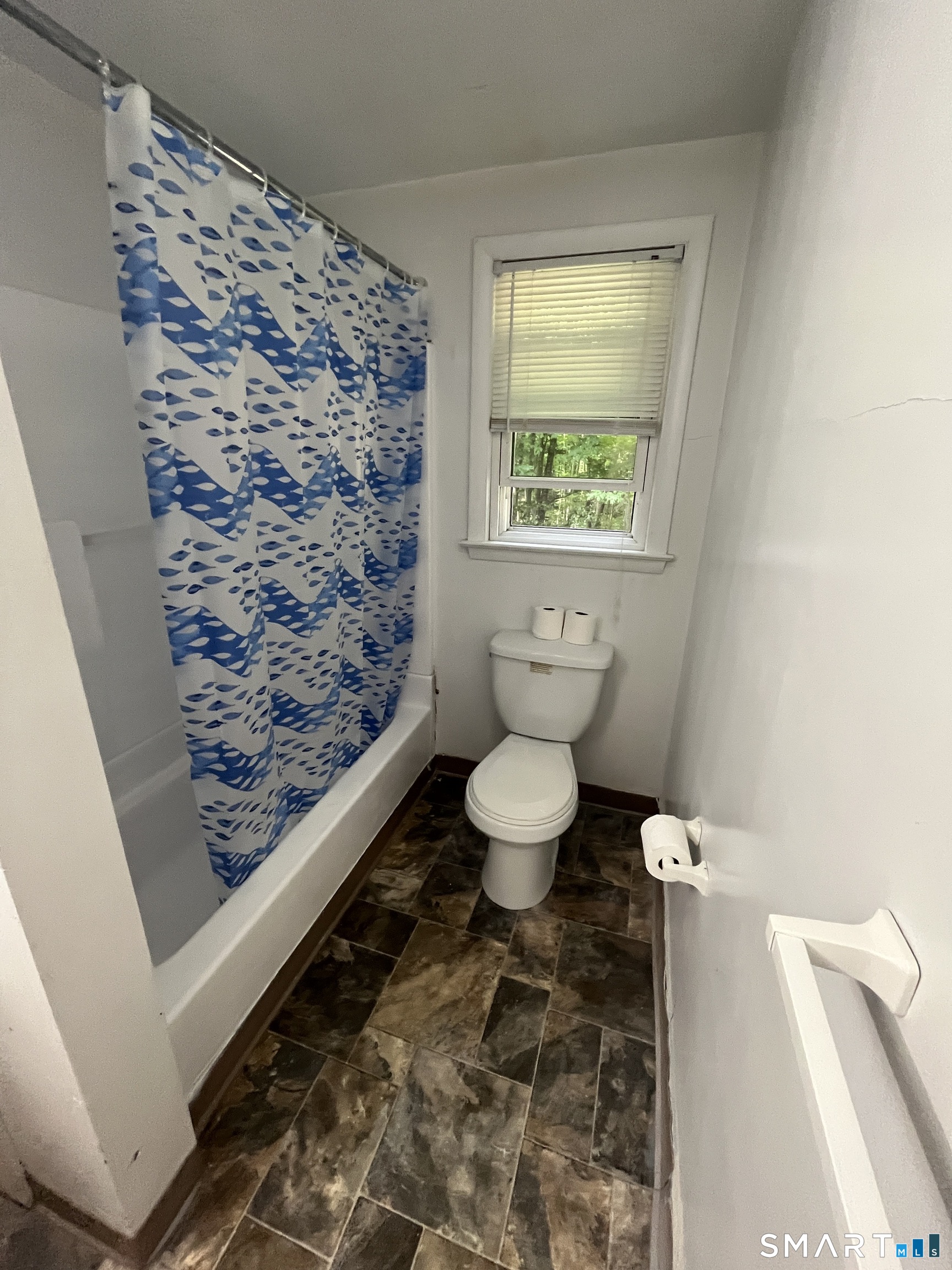 332 Richmond Road Coventry, CT 06238 - Photo 4 of 15 a bathroom with a toilet and a shower curtain