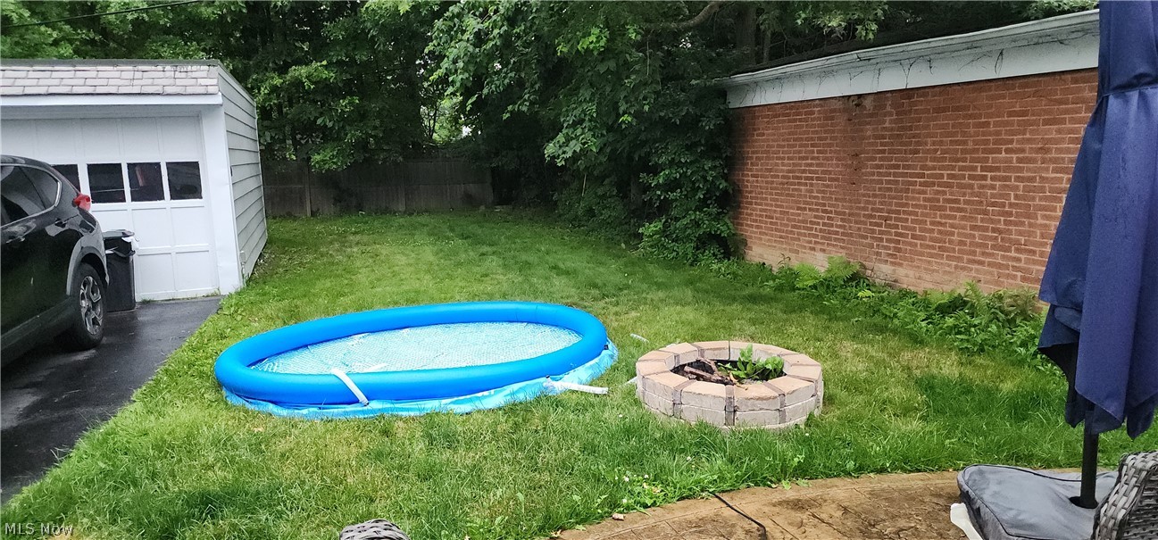 2164 Fenwick Road Cleveland, OH 44118 - Photo 4 of 4 View of yard with an outdoor structure and a pool
