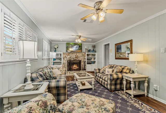 a living room with furniture and a fireplace